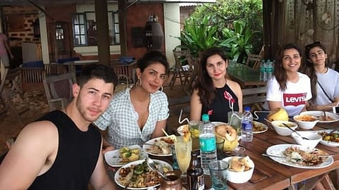 SEEING STARS: Singer Nick Jonas (far left) with his wife, actress Priyanka Chopra (second from left) at Pousada by the Beach.