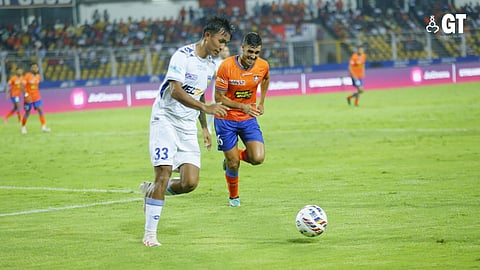 GO FOR IT: Chennaiyin FC's Bikash Yumnan and FC Goa's Borja Herrera vie for the ball at the Fatorda stadium on Sunday, April 14.