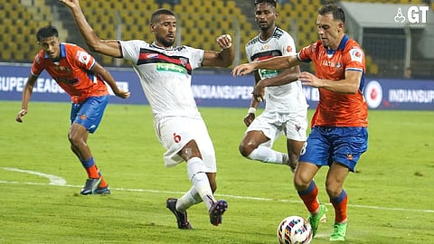 HARD FOUGHT: FC Goa's Dejan Drazic and Mohammed Ali Bemammer of North East in action during the match.