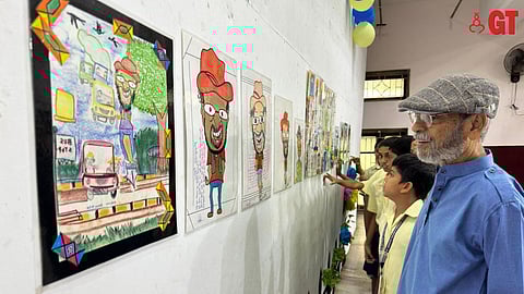 FUNNY MAN, ALEXYZ: The cartoonist marvelled at the work of the youngsters.