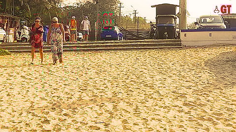 Tourists head for the beach in Goa early in the morning.