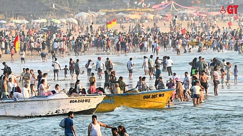 Tourists enjoy on the beach on New Year's Eve.