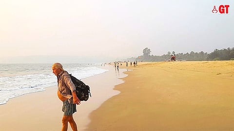 A foreign tourist on a beach in Goa.
