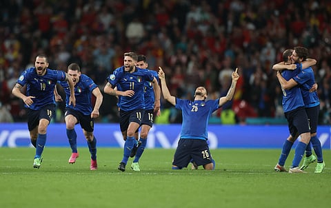 Italy's players celebrate after winning the UEFA EURO 2020 semi-final football match between Italy and Spain at Wembley Stadium in London on July 6, 2021. (AFP)