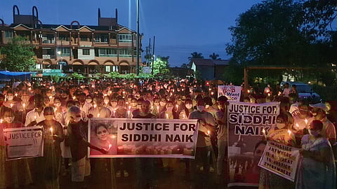 Hundreds of people held a candlelight procession on Monday at Aldona,
