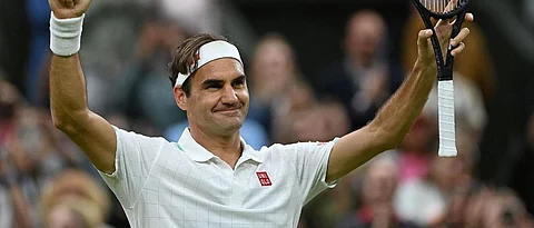 Roger Federer celebrates winning against Italy's Lorenzo Sonego during their men's singles fourth round match on the seventh day of the 2021 Wimbledon Championships at The All England Tennis Club in Wimbledon, (AFP)
