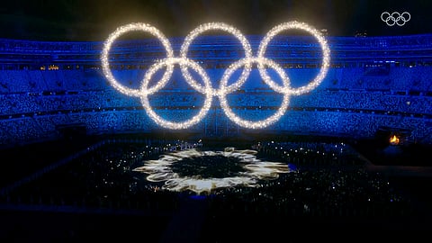 A display of luminous colours swirl together forms the Olympic Rings during the closing ceremony of the Tokyo Olympic 2020, in Tokyo on Sunday.