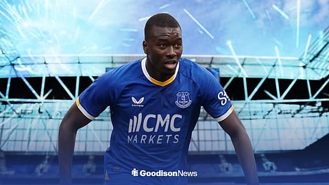 Pape Gueye in an Everton home shirt 2026-27, standing outside Hill Dickinson Stadium, ahead of blue fireworks.