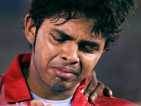 Kings XI Punjab pacer S Sreesanth is in tears after being slapped by Mumbai Indians captain Harbhajan Singh during the IPL T-20 match in Mohali