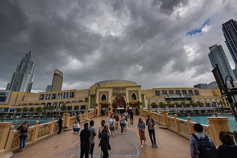 People enjoy the breezy and cloudy weather in Dubai