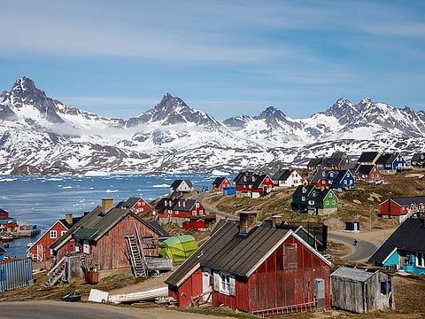 Snow covered mountains rise above the harbour and town of Tasiilaq, Greenland, June 15, 2018. The report is the latest in a litany of warnings about the threat posed to the Antarctic and Greenland ice sheets from global warming. Commenting on the findings, Guofinna Aoalgeirsdottir at the University of Iceland and lead author of the IPCC's sixth assessment report, said the study was "timely." "Their satellite observations show that both melting and ice discharge from Greenland have increased since observations started," Aoalgeirsdottir said, warning that 2019 was likely to be a record year for ice loss.