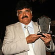 Umpire Tariq Butt after receiving life time achievement award from Arjuna Ranatunga at the 13th Annual Shyam Bhatia Annual UAE Awards on Wednesday night.