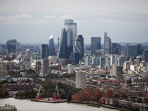 The skyline of London, is seen beyond the River Thames in London, England.