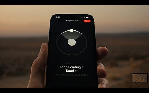 File photo: With the SOS feature, iPhones using Globalstar allows users to manually share their location over a satellite when there is no cellular or Wi-Fi connection. The next challenge for Apple: forward compatibility with 5G direct-to-cell tech by Starlink and others.