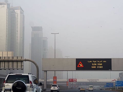 Morning commuters and pedestrians in Dubai are faced with dusty skies as a sandstorm passes through the city.