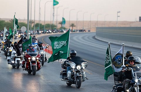 Citizens and residents will celebrate over the coming week with events paying homage to the Kingdom’s heritage, art and culture. Above, Saudi and expat bikers wave national flags as they ride their motorcycles around the capital Riyadh during a parade to mark the Saudi national day.