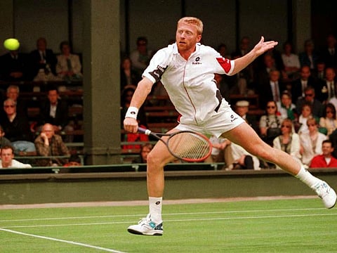 Germany's Boris Becker in action during his first-round match against France's Jean-Phillipe Fleurian at Wimbledon on June 24, 1996.