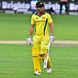 Chris Lynn leaves the pitch after being dismissed during the second T20 cricket match between Pakistan and Australia at the International cricket Stadium in Dubai on October 26, 2018.