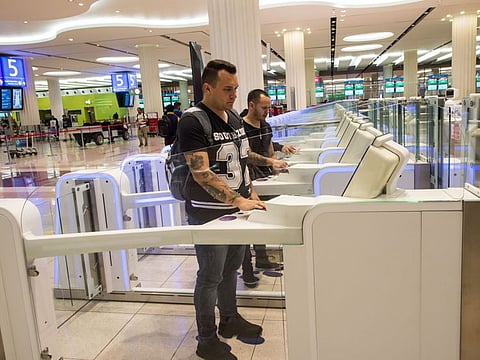 Passengers using smart gates at Dubai International airport terminal-3.
