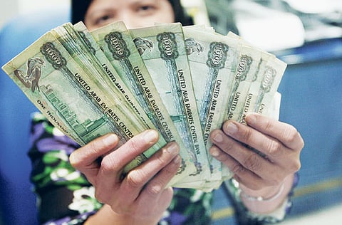 The first issuance details of the T-Sukuk, including the return offered and subscription timeline, are expected to be released shortly. File image of a teller at an Al Ansari exchange branch in Karama used for illustrative purposes.