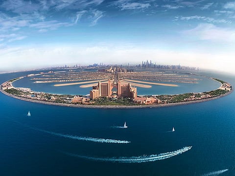 The Palm Jumeirah, one of Dubai's iconic locations and a big draw for visitors, even in the summer heat.