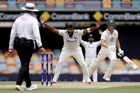 Indias Jasprit Bumrah (C) appeals unsuccessfully for LBW for Australias Nathan McSweeney (R) on day five of the third cricket Test match between Australia and India at The Gabba in Brisbane on December 18, 2024.