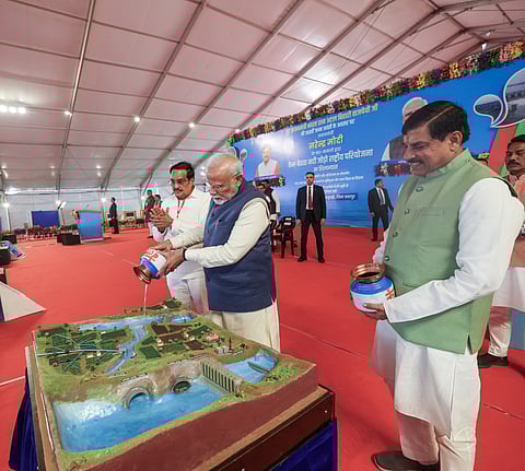 Prime Minister Narendra Modi lays the foundation stone for the Ken-Betwa River Linking Project, in Khajuraho on Wednesday. Union Minister of Jal Shakti CR Patil and Madhya Pradesh Chief Minister Mohan Yadav are also seen.