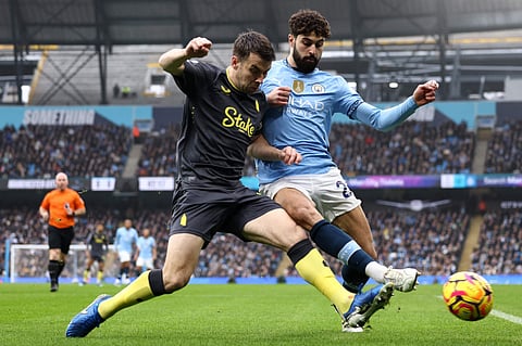 Everton's Irish defender Seamus Coleman (left) vies with Manchester City's Croatian defender Josko Gvardiol during the English Premier League football matchat the Etihad Stadium in Manchester, north west England, on Thursday.