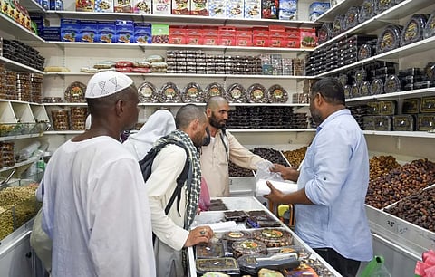 Pilgrims shop for gifts at Medina stores before their departure from Saudi Arabia.