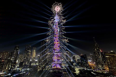 A light show and fireworks illuminate the Burj Khalifa, the world’s tallest building, during New Year's Eve celebrations in Dubai on January 1, 2025.