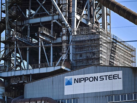 This photo shows signage on the exterior of a blast furnace building during a media tour by Japanese company Nippon Steel at their East Nippon Works Kashima Area facility in Kashima, Ibaraki prefecture, north of Tokyo on December 6, 2024.