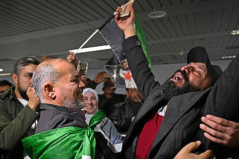 A traveller is welcomed as he arrives at the Damascus International Airport on January 7, 2025. International flights resumed at Syria's main airport in Damascus on Tuesday for the first time since Islamist-led rebels toppled President Bashar Al Assad last month.