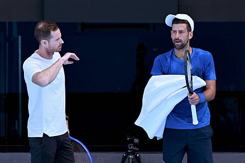 Serbia's Novak Djokovic (right) listens to coach Andy Murray during a training session ahead of the Australian Open tennis tournament in Melbourne on January 9.