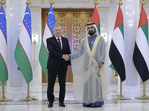 Sheikh Mohammed with Shavkat Mirziyoyev (left)