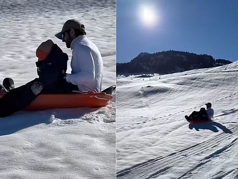 Sheikh Hamdan sledging with his son, at their winter vacation.