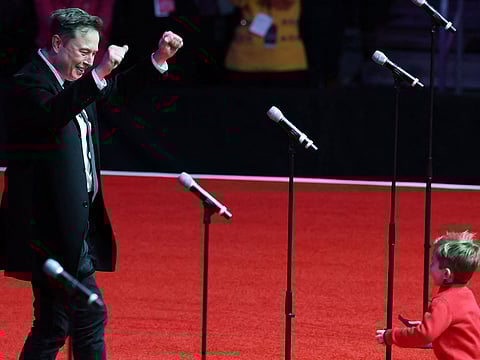 Elon Musk and his son X appear on stage at President-Elect Donald Trump's victory rally at the Capital One Arena on January 19, 2025 in Washington, DC.