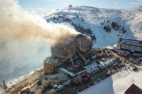 A fire rages on the fourth floor of the 11-storey hotel in Bolu, Turkey.