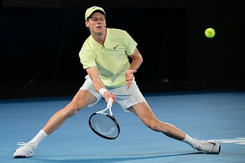 Italy's Jannik Sinner hits a return against Australia's Alex De Minaur during their men's singles quarter-final match on day eleven of the Australian Open tennis tournament in Melbourne on Wednesday.