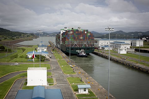 A merchant ship passes through the Panama Canal.