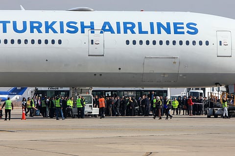Passengers disembark from a Turkish Airlines aircraft carrying a diplomatic delegation from Ankara and an aid shipment provided by the Turkish Red Crescent, at the Damascus International Airport in the Syrian capital on January 23, 2025.
