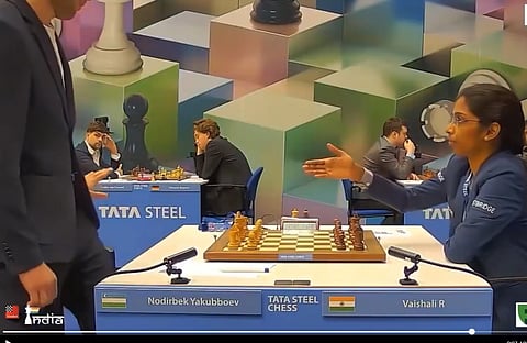 India's Rameshbabu Vaishali extends her hand to Uzbekistan's Nodirbek Yukubboev, who politely waved his hands.