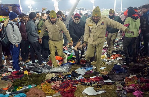 A devotee being rescued following a stampede at Kumbh Mela in Prayagraj, India.