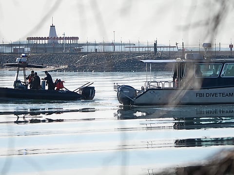 Emergency response units search near the crash site of an American Airlines plane on the Potomac River after an accident last night while on approach to Reagan National Airport on January 30, 2025 in Arlington, Virginia.