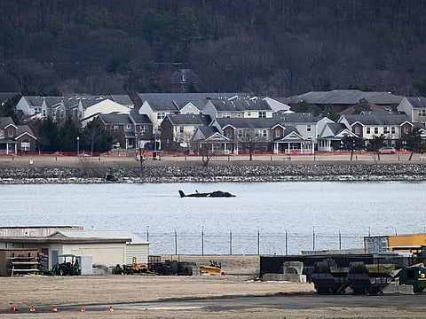 Part of the wreckage is seen along the Potomac River after American Airlines flight 5342 on approach to Reagan National Airport crashed into the river after colliding with a US Army helicopter, near Washington, DC, on January 30, 2025.