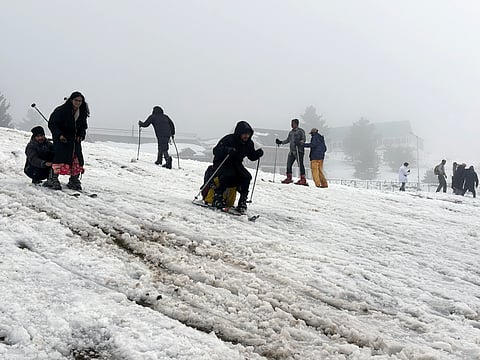 Tourists enjoy skiing on the snow-covered area after the upper reaches of Jammu & Kashmir receive fresh snowfall, at Gulmarg. Around 3.5 million tourists visited Kashmir in 2024, according to official figures, the majority domestic visitors.