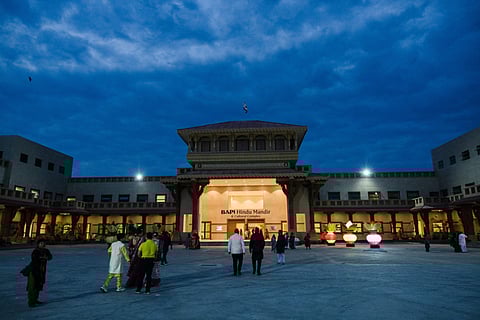 Devotees arrive before sunrise for the consecration ceremony and opening of the first phase of the BAPS (Bochasanwasi Akshar Purushottam Swaminarayan Sanstha) Hindu Mandir in Johannesburg on February 2, 2025.