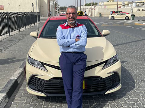 On a mission: Ammar Shams as a Dubai taxi driver.