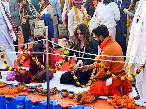 Foreign diplomats perform rituals at Triveni Sangam during the ongoing Maha Kumbh 2025, in Prayagraj on Saturday.