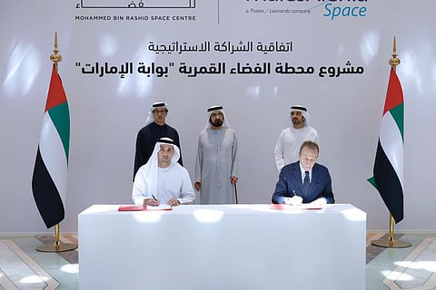 Sheikh Mohammed bin Rashid Al Maktoum, Sheikh Hamdan bin Mohammed bin Rashid and Sheikh Mansour bin Zayed Al Nahyan witness the signing of