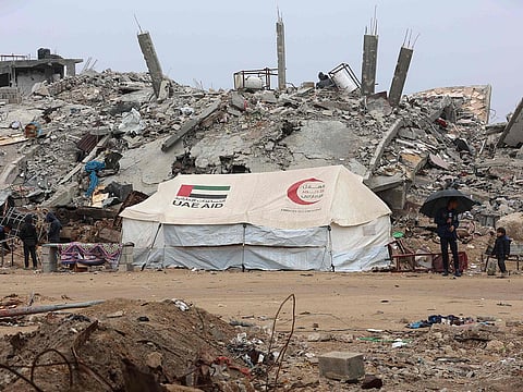 A UAE AID tent stands in front of a collapsed building at Saftawi street in Jabalia in the northern Gaza Strip on February 5, 2025, during a ceasefire deal in the war between Israel and Hamas.